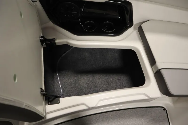 Slide: The Image of Interior storage compartment of 2025 Yamaha Boats 250 SX, featuring sleek design and ample space. - 14