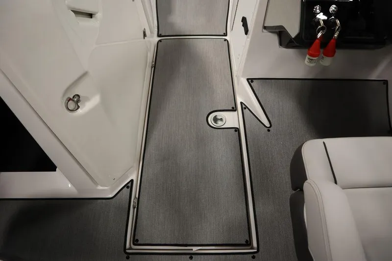 Slide: The Image of 2025 Yamaha Boats 250 SX interior with sleek flooring and modern design. - 17