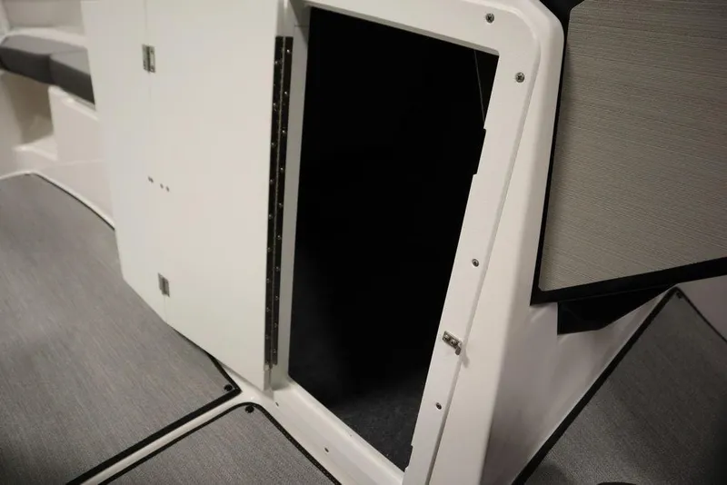 Slide: The Image of Open storage compartment on 2025 Yamaha Boats 250 SX with sleek interior design. - 20