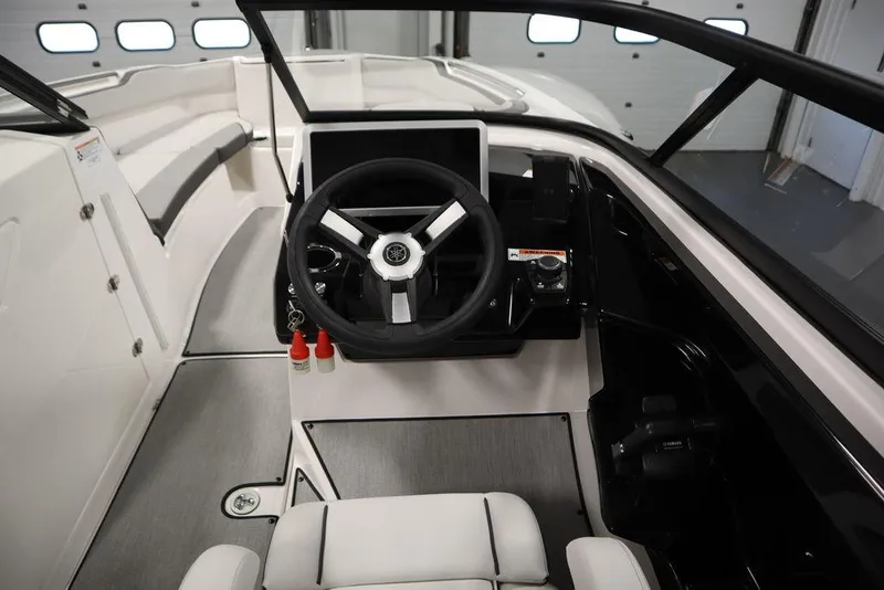 Slide: The Image of 2025 Yamaha Boats 250 SX cockpit with modern steering and controls. - 22