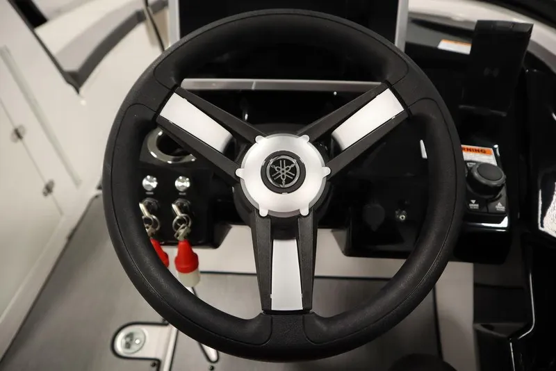 Slide: The Image of Steering wheel of 2025 Yamaha Boats 250 SX, featuring sleek design and controls. - 23
