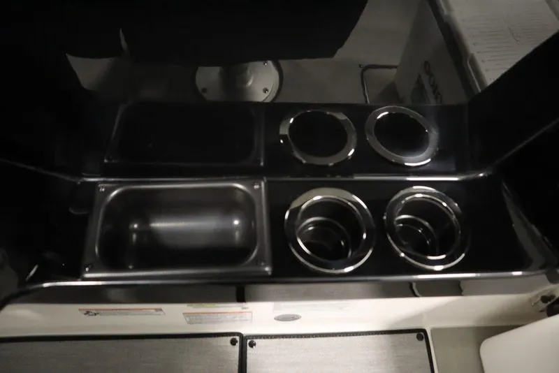 Slide: The Image of Yamaha Boats 250 SX 2025 interior cup holders and storage compartment. - 28
