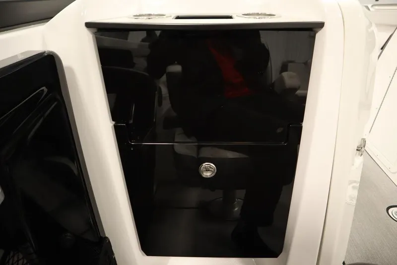Slide: The Image of 2025 Yamaha Boats 250 SX interior with sleek black storage compartment. - 34