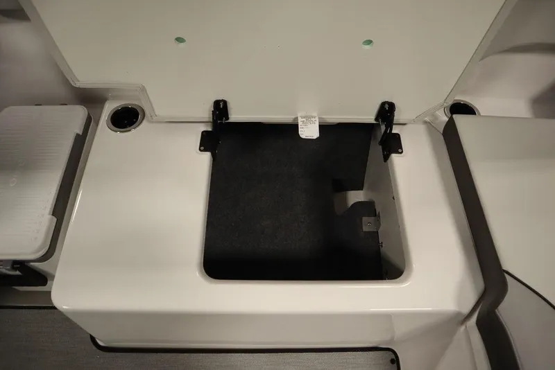 Slide: The Image of Open storage compartment on 2025 Yamaha Boats 250 SX. - 40