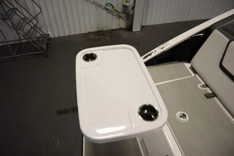 Slide: The Image of Yamaha Boats 250 SX 2025 model, featuring a sleek white table with cup holders. - 45