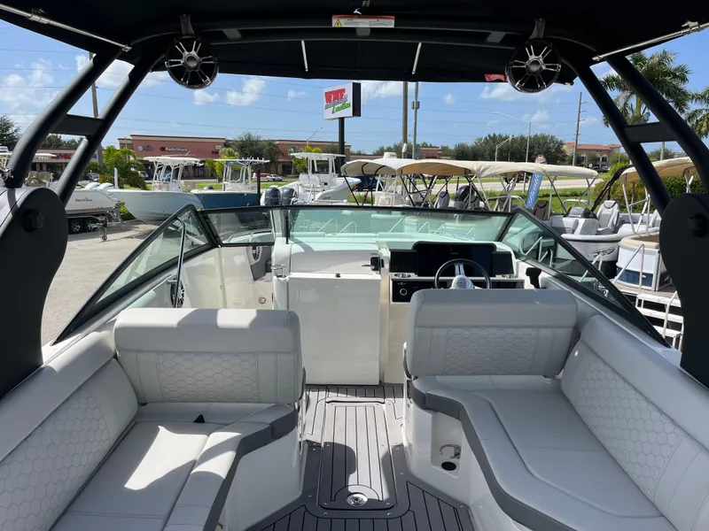 Slide: The Image of 2021 Sea Ray SDX 250 Outboard boat interior with spacious seating and modern design. - 10