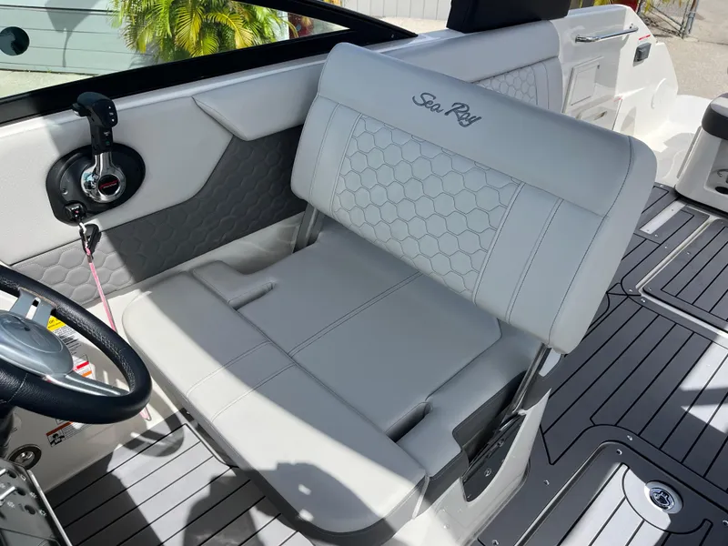 Slide: The Image of 2021 Sea Ray SDX 250 Outboard interior with luxurious seating and modern design. - 12