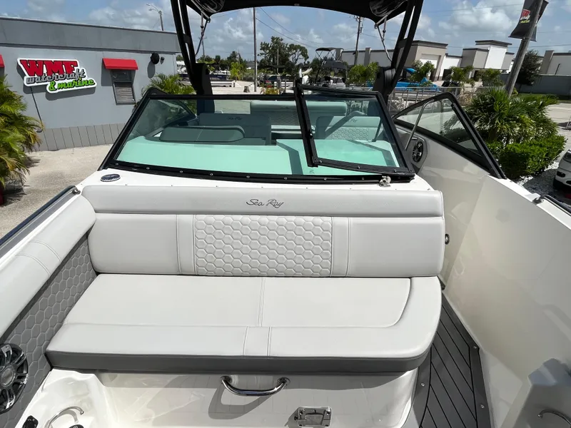Slide: The Image of 2021 Sea Ray SDX 250 Outboard boat with white seating and open deck view. - 14