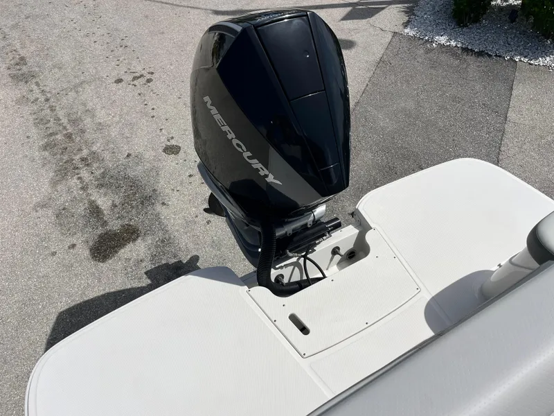 Slide: The Image of 2021 Sea Ray SDX 250 Outboard with Mercury engine, rear view on pavement. - 18