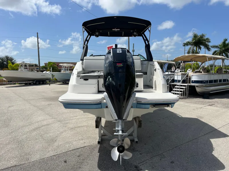 Slide: The Image of 2021 Sea Ray SDX 250 Outboard boat, rear view, parked on a sunny day. - 3
