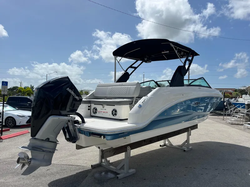 Slide: The Image of 2021 Sea Ray SDX 250 Outboard boat with black canopy, displayed outdoors. - 4