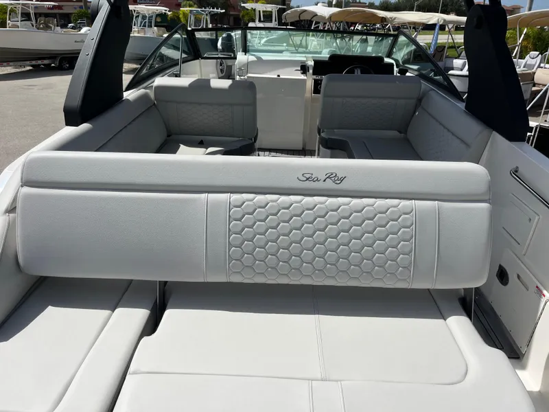 Slide: The Image of 2021 Sea Ray SDX 250 Outboard boat interior with spacious seating and modern design. - 5