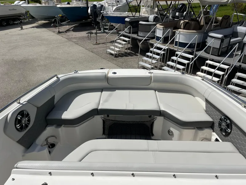 Slide: The Image of 2021 Sea Ray SDX 250 Outboard boat with spacious seating in a marina. - 6
