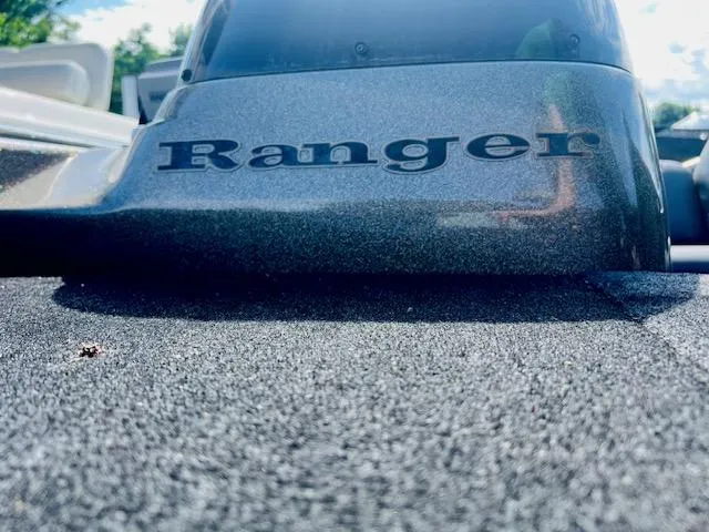 Slide: The Image of Close-up of 2003 Ranger 195VS boat with logo on textured surface. - 5