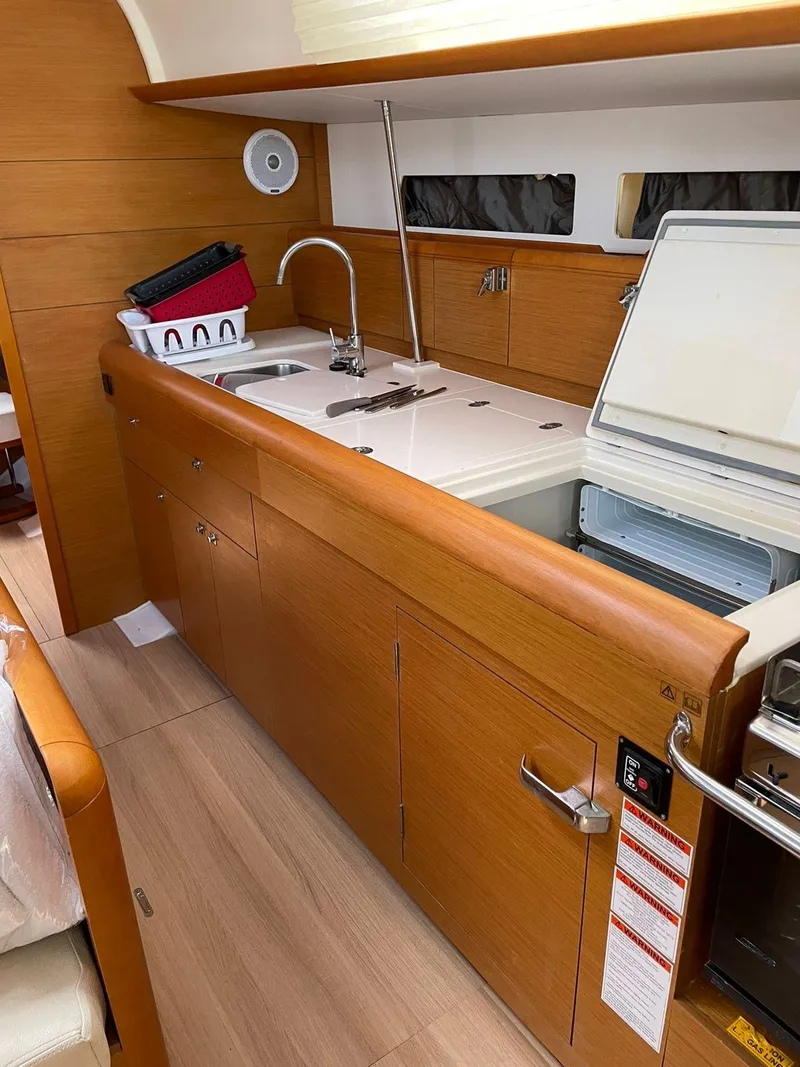 Slide: The Image of Interior view of 2016 Jeanneau Sun Odyssey 479 yacht kitchen area. - 20