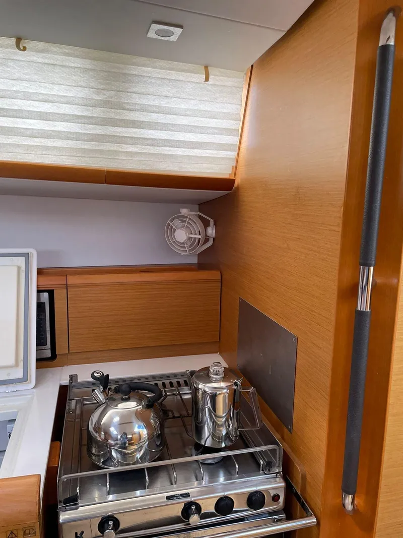 Slide: The Image of 2016 Jeanneau Sun Odyssey 479 yacht kitchen with stove and kettle. - 24