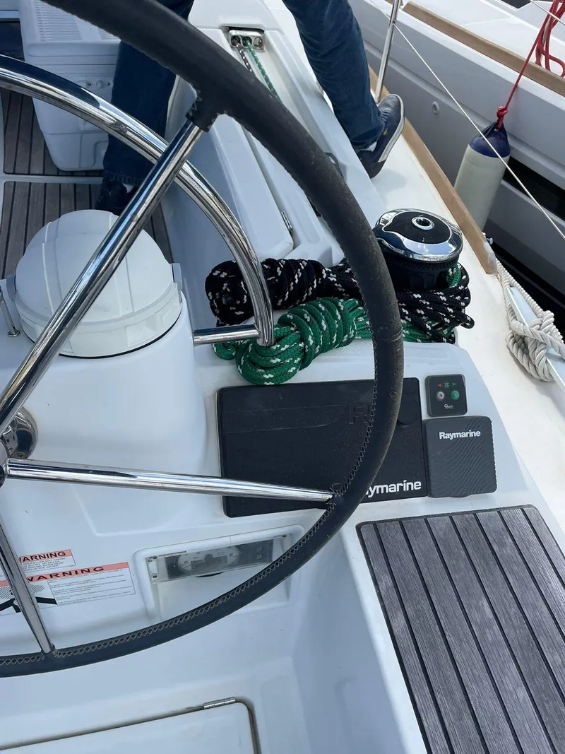 Slide: The Image of Steering wheel and controls on 2016 Jeanneau Sun Odyssey 479 sailboat deck. - 36