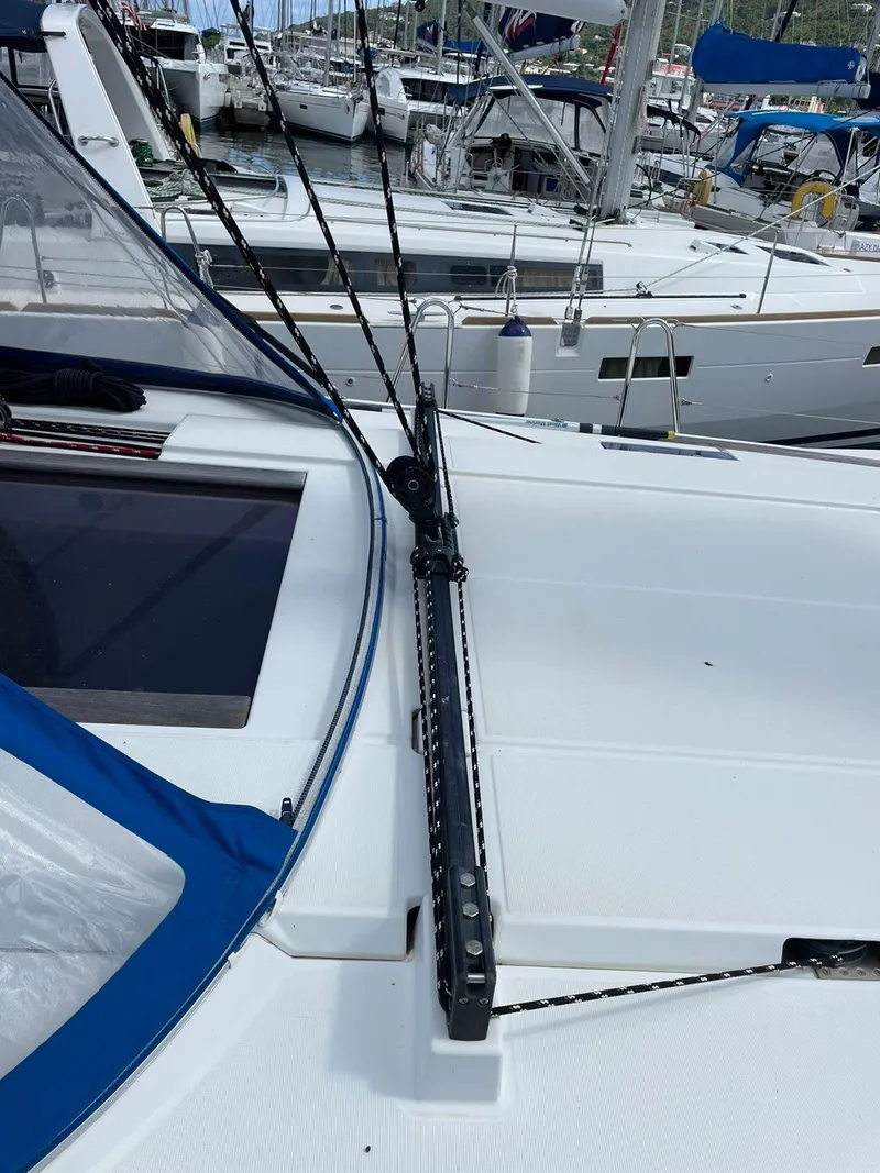 Slide: The Image of 2016 Jeanneau Sun Odyssey 479 sailboat deck with rigging in marina. - 37