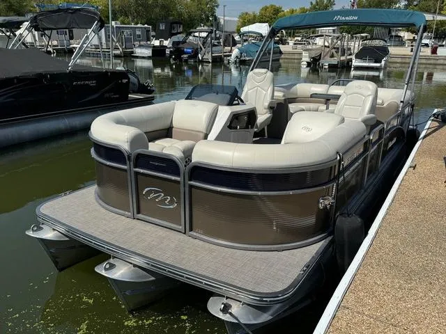 Slide: The Image of 2021 Manitou RF 23 Oasis VP pontoon boat docked at marina. - 4