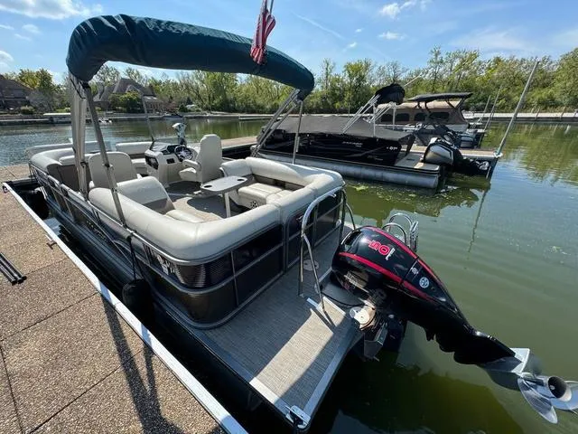 Slide: The Image of 2021 Manitou RF 23 Oasis VP pontoon boat docked on a sunny day. - 5