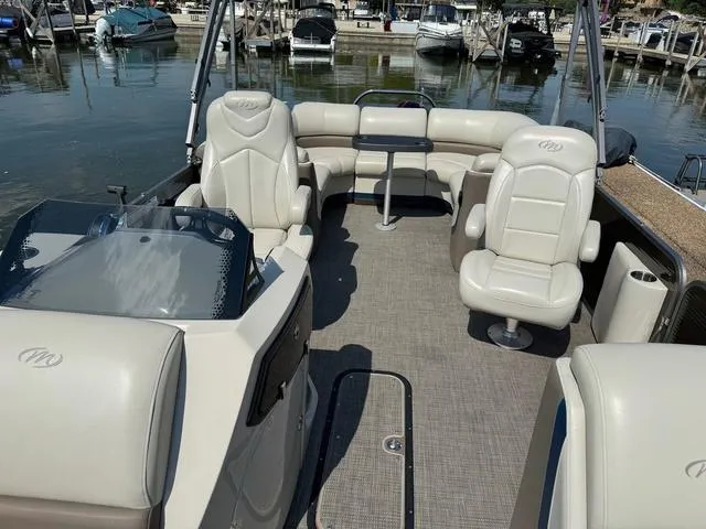 Slide: The Image of 2021 Manitou RF 23 Oasis VP pontoon boat interior with plush seating and table. - 9