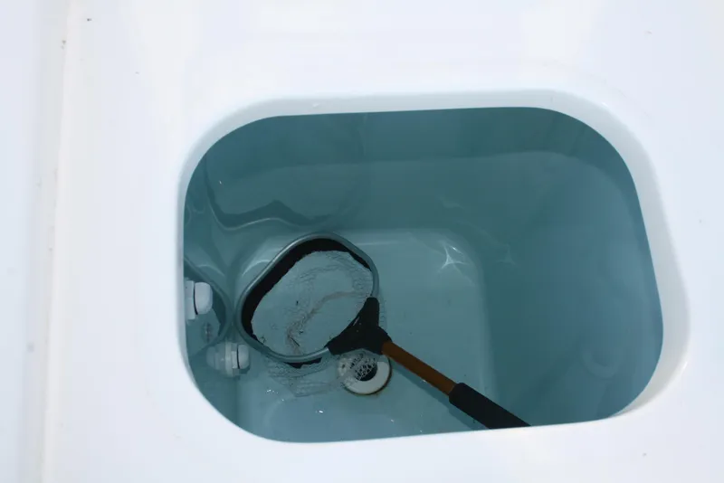 Slide: The Image of Livewell with net in 2018 Pursuit S 328 Sport boat. - 9