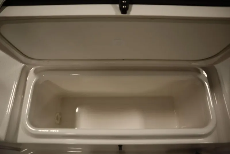 Slide: The Image of Open storage compartment in 2025 Yamaha Boats 190 FSH Sport. - 15