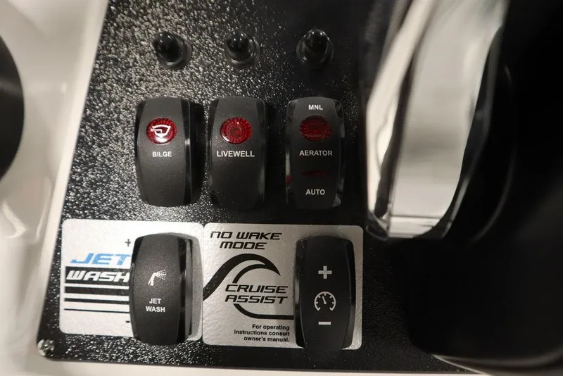 Slide: The Image of Control panel of 2025 Yamaha Boats 190 FSH Sport with various switches and features. - 27