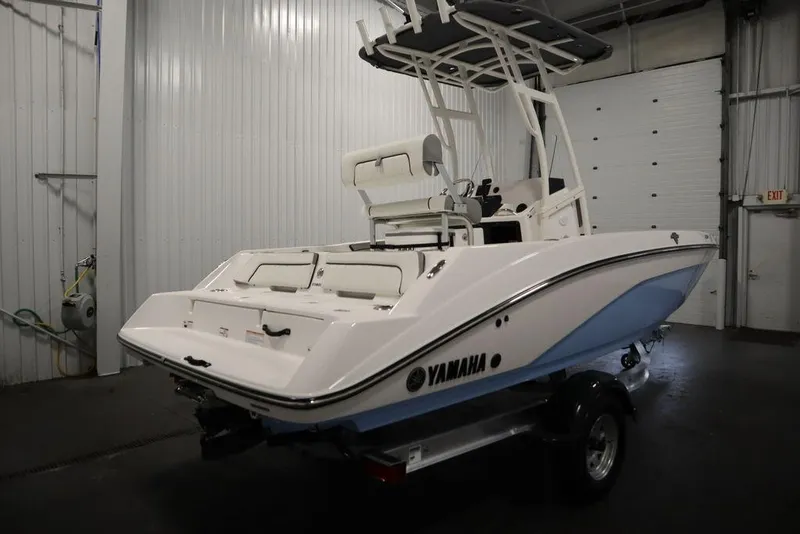 Slide: The Image of 2025 Yamaha Boats 190 FSH Sport in a garage, showcasing sleek design and modern features. - 3