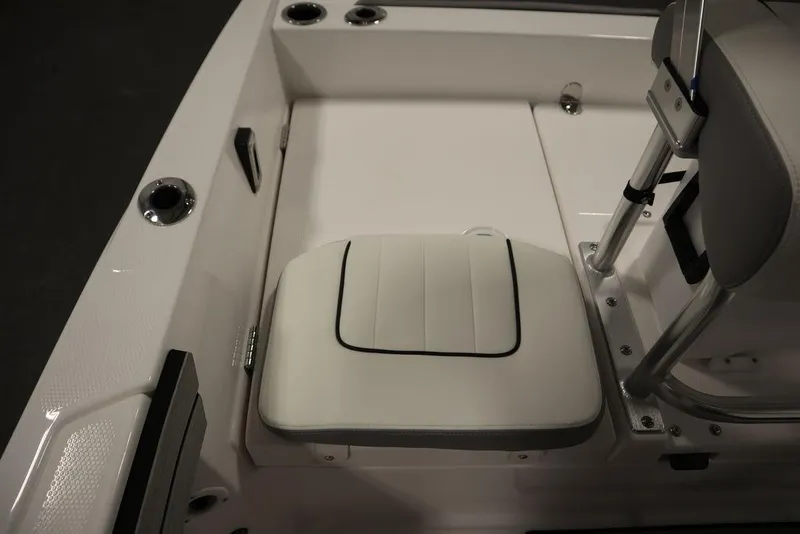 Slide: The Image of 2025 Yamaha Boats 190 FSH Sport interior seating detail, white upholstery, modern design. - 35