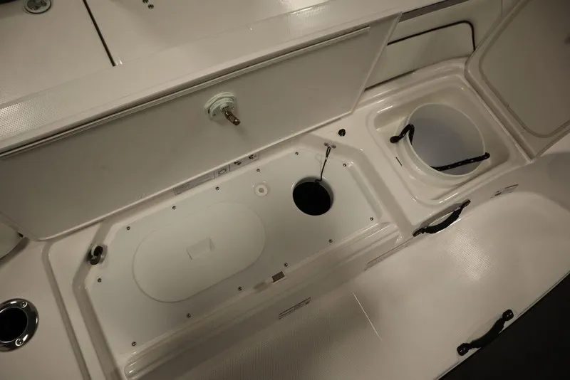 Slide: The Image of Interior view of 2025 Yamaha Boats 190 FSH Sport, showcasing storage compartments and fixtures. - 40