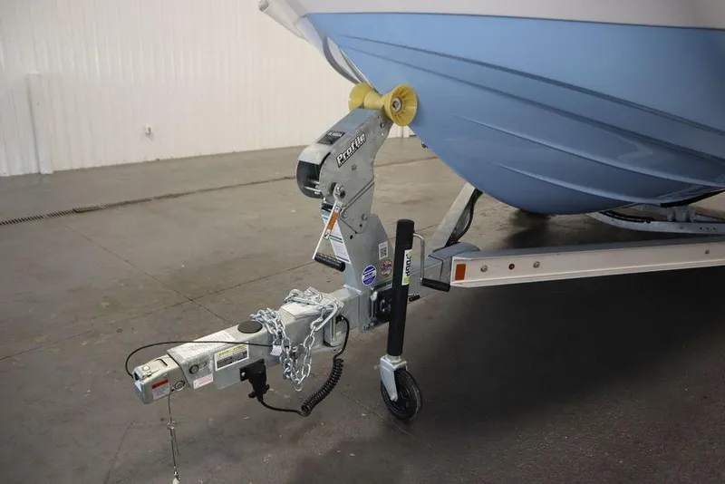 Slide: The Image of 2025 Yamaha Boats 190 FSH Sport on trailer, close-up of hitch and bow. - 44