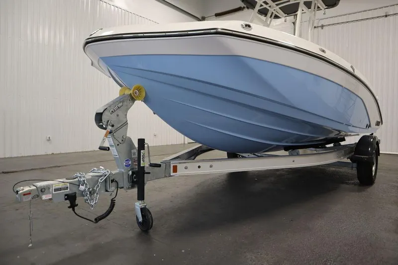 Slide: The Image of 2025 Yamaha Boats 190 FSH Sport on trailer in indoor storage. - 46