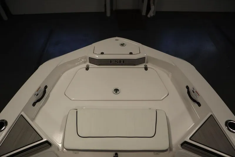 Slide: The Image of Bow view of 2025 Yamaha Boats 190 FSH Sport, featuring sleek design and storage compartments. - 9