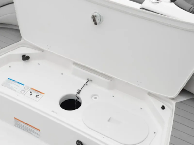 Slide: The Image of 2025 Yamaha Boats 190 SX storage compartment with open lid and safety instructions. - 5