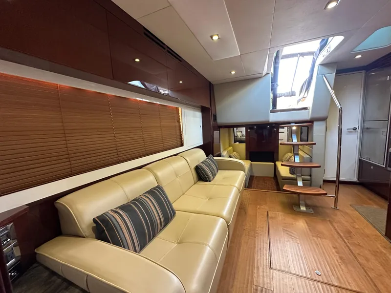 Slide: The Image of Luxurious interior of 2015 Sea Ray 410 Sundancer yacht with beige leather seating. - 13