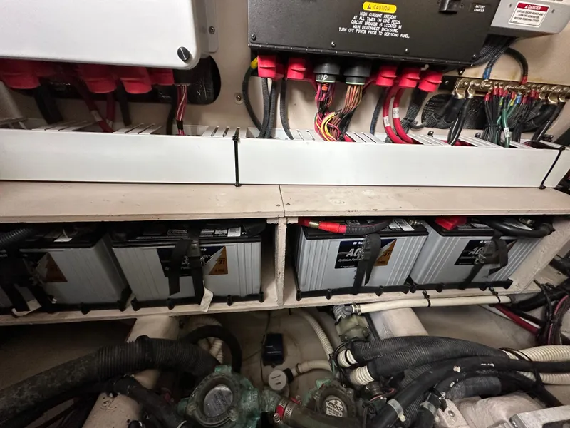 Slide: The Image of Engine room of 2015 Sea Ray 410 Sundancer with batteries and wiring. - 20
