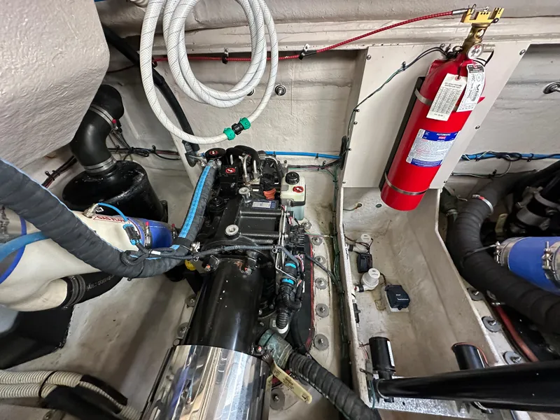 Slide: The Image of Engine room of 2015 Sea Ray 410 Sundancer with fire extinguisher and wiring. - 22