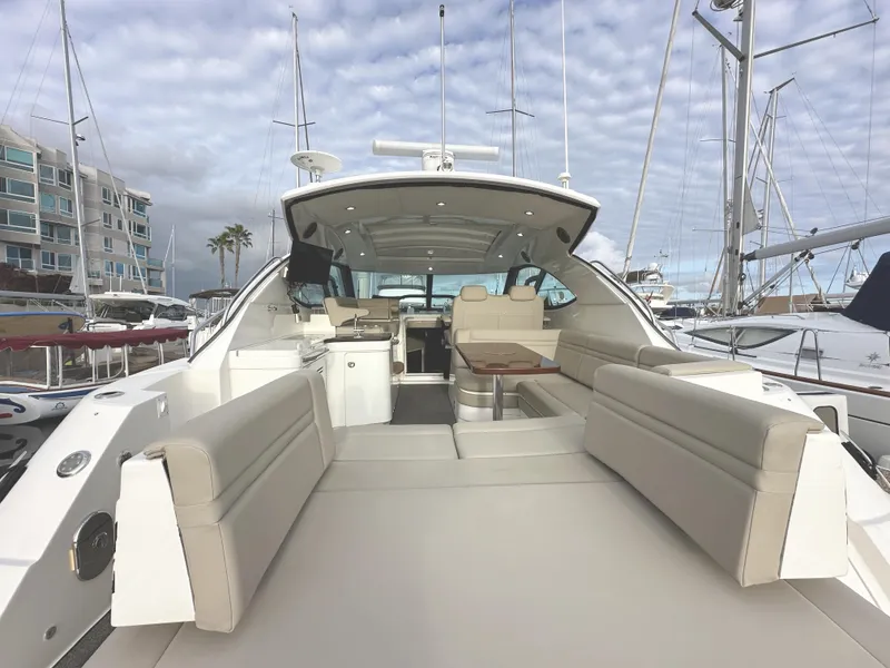 Slide: The Image of 2015 Sea Ray 410 Sundancer yacht with spacious deck and luxurious seating. - 4