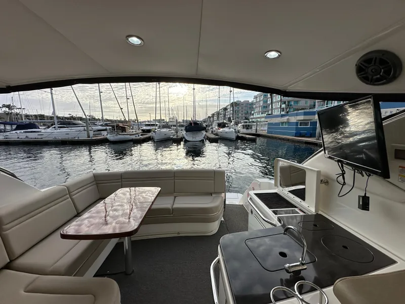 Slide: The Image of Luxurious 2015 Sea Ray 410 Sundancer yacht interior with marina view. - 7