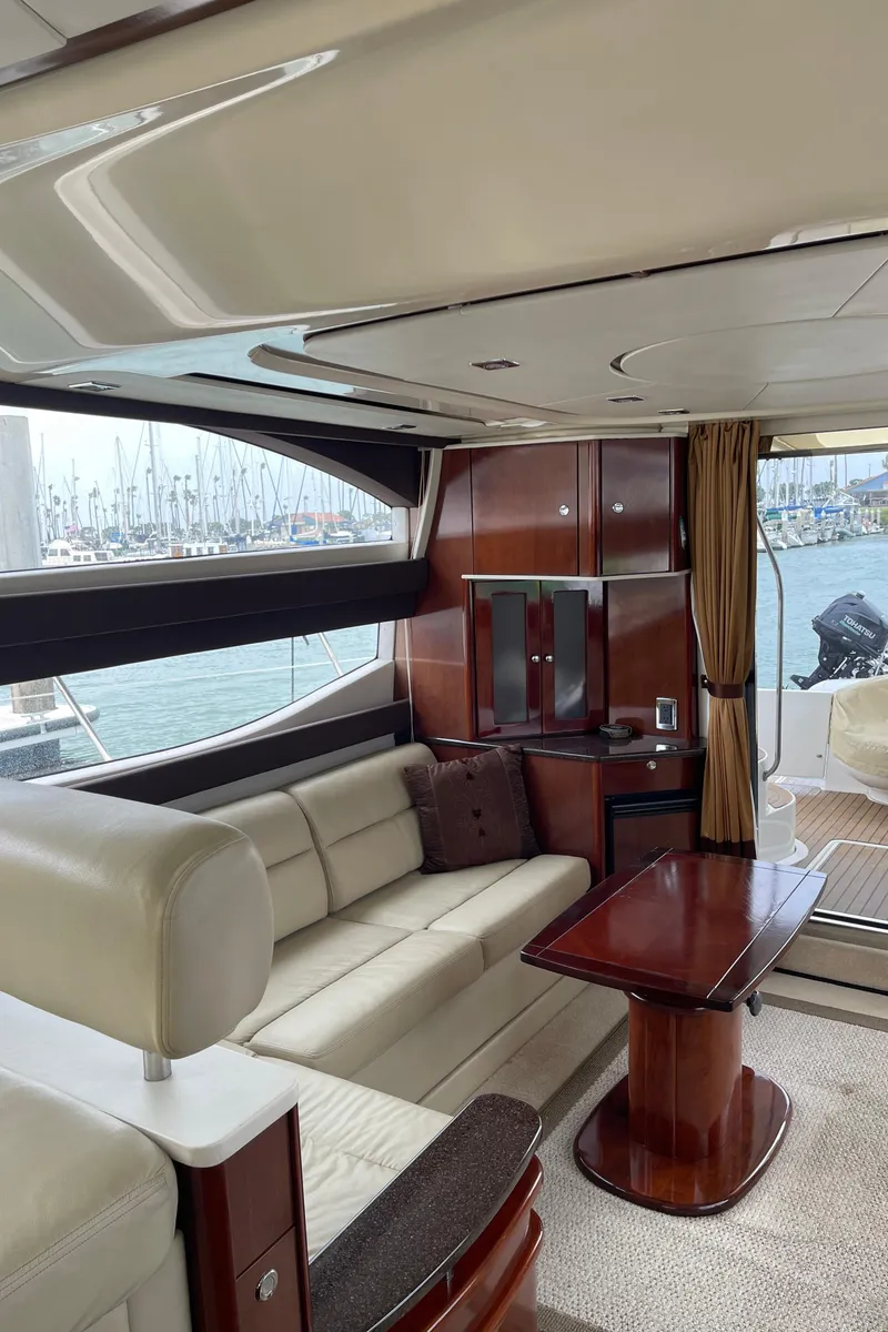 Slide: The Image of Luxurious interior of 2011 Meridian 441 Sedan Bridge yacht with elegant seating and wood finishes. - 10