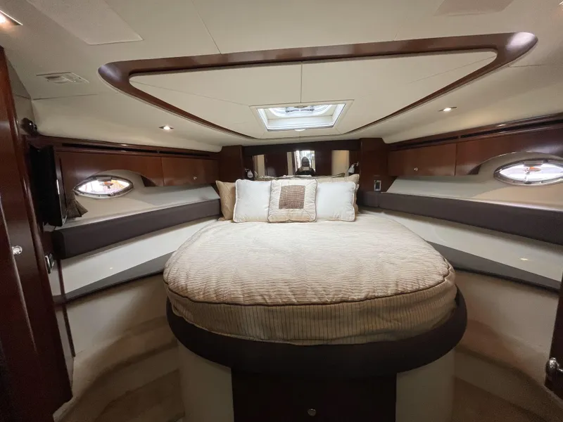 Slide: The Image of Luxurious 2011 Meridian 441 Sedan Bridge bedroom with elegant wood accents and plush bedding. - 11