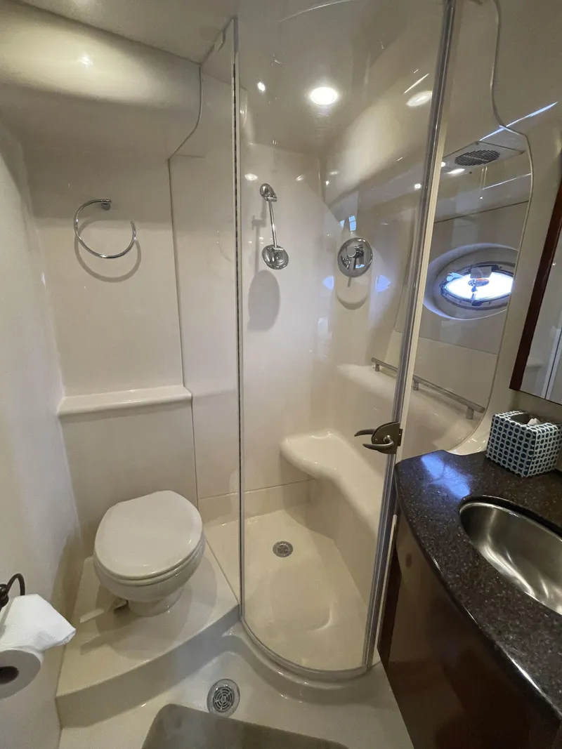 Slide: The Image of Luxurious bathroom in 2011 Meridian 441 Sedan Bridge yacht, featuring shower and modern fixtures. - 13