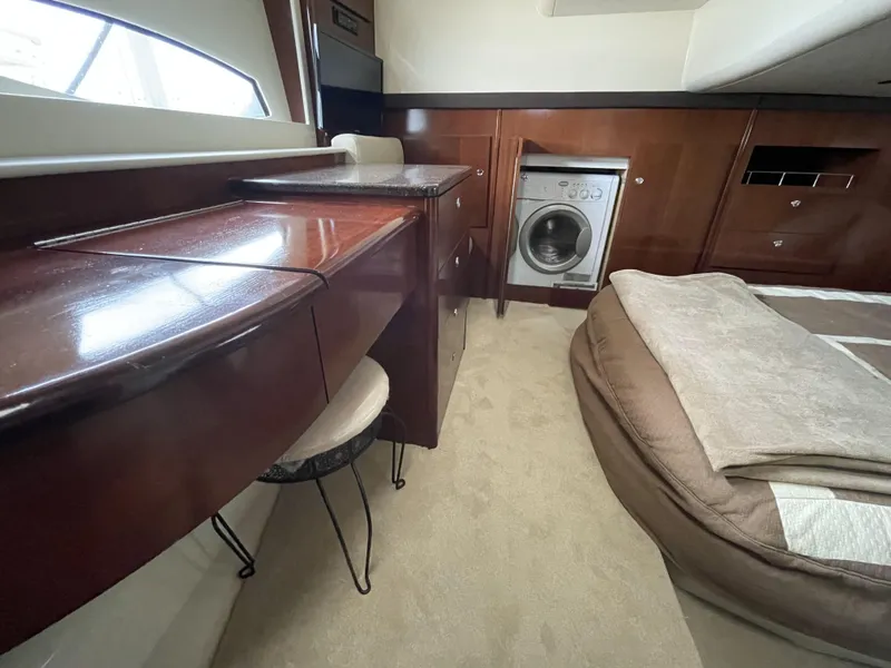 Slide: The Image of Luxurious 2011 Meridian 441 Sedan Bridge interior with washer and elegant wood cabinetry. - 15
