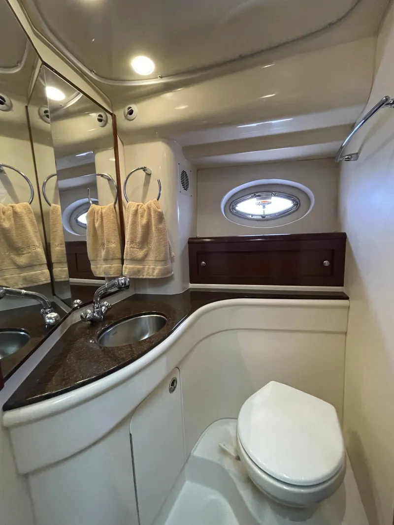 Slide: The Image of Luxurious bathroom in 2011 Meridian 441 Sedan Bridge yacht, featuring modern fixtures and elegant design. - 16