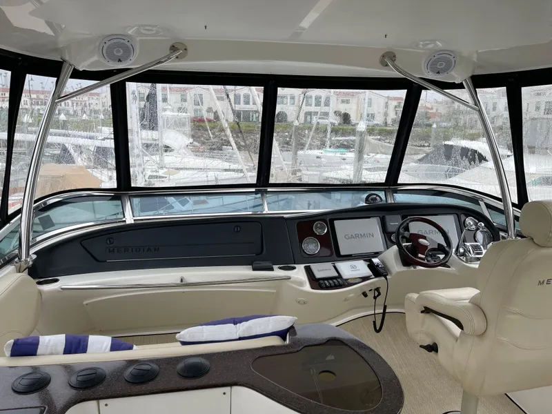 Slide: The Image of 2011 Meridian 441 Sedan Bridge helm with modern navigation equipment and comfortable seating. - 19