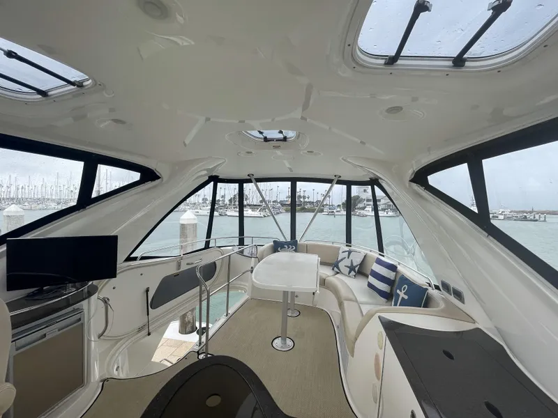 Slide: The Image of Luxurious interior of 2011 Meridian 441 Sedan Bridge yacht with panoramic windows. - 21