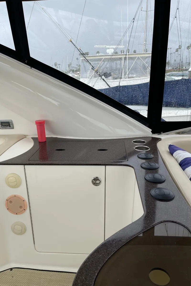 Slide: The Image of 2011 Meridian 441 Sedan Bridge interior with sleek countertops and marina view. - 24