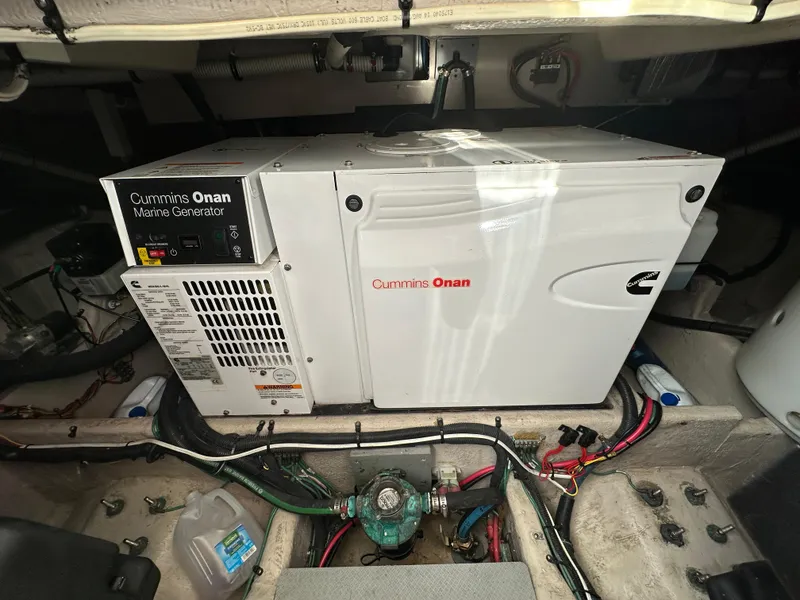 Slide: The Image of Cummins Onan marine generator in 2011 Meridian 441 Sedan Bridge engine room. - 25