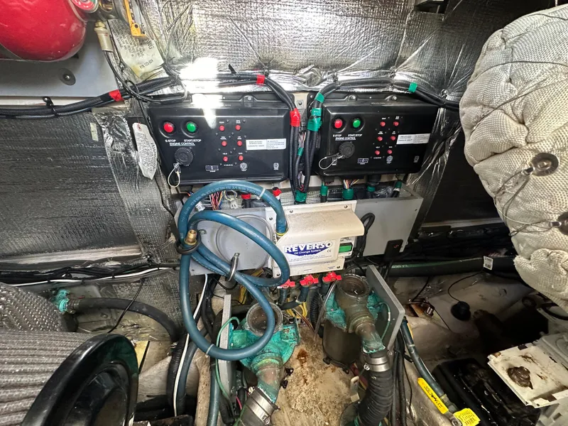 Slide: The Image of Engine room of 2011 Meridian 441 Sedan Bridge, showcasing control panels and wiring. - 28